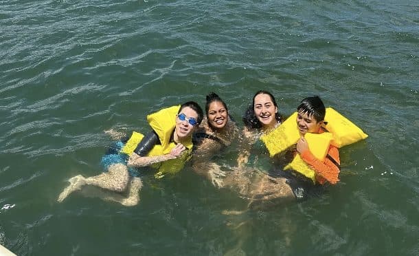 A group floating together in life jackets